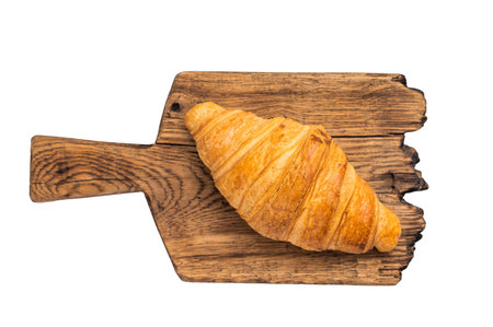 French baked croissant on wooden board isolated on white backgroundの写真素材