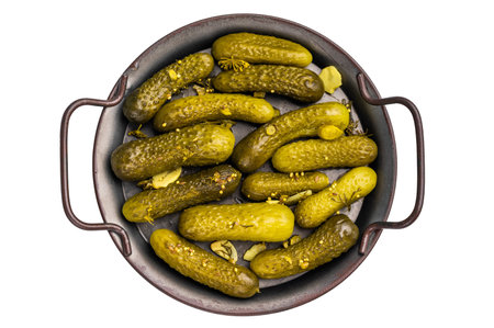 Freshly jarred dill pickles, a delightful addition to any meal or charcuterie board that adds a zesty crunch. isolated on white background. top view.の写真素材