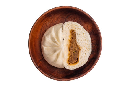 Steamed bun with meat on plate isolated on white background. top view.