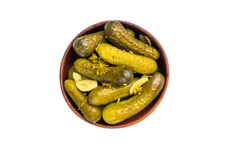 Pickled Gherkins beautifully arranged and ready to elevate your culinary creations with their bold taste. isolated on white background. top view.の写真素材
