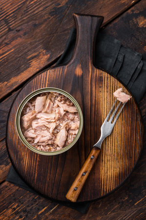 Freshly opened tinned canned tuna, showing its rich texture and flavor, a must-have for any pantry. isolated on white background. top view.の写真素材