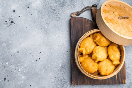 Japanese Taiyaki Fish Shaped Cake with Sweet Red Bean Paste. grey background. top view.の写真素材