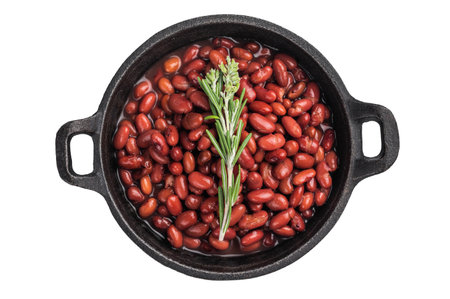 Red kidney beans with a sprig of rosemary in a cast iron pan. Overhead shot emphasizing fresh herbs and savory flavorの写真素材