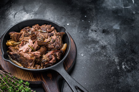 Beef bourguignon stew with tender beef in a pan. black background. top view.の写真素材