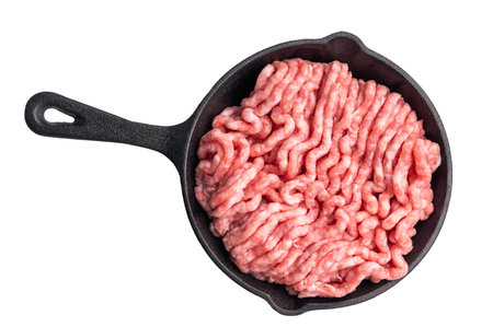 Minced meat in a frying pan isolated on white background. Top view.の写真素材