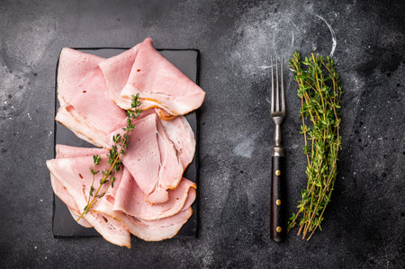 Thinly Sliced Pork Ham. black background. top view.の写真素材