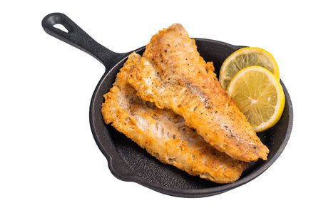 Pan Fried Hake white fish fillet isolated on white background. top view.