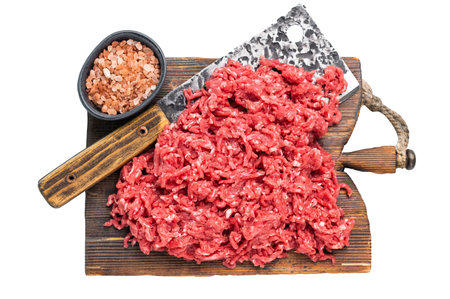 Chopped ground beef raw meat, mince on a cutting board, isolated on white backgroundの写真素材
