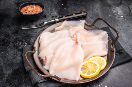 Fresh raw squid ready for preparation, perfect for sushi, stir-fries, or gourmet seafood dishes....