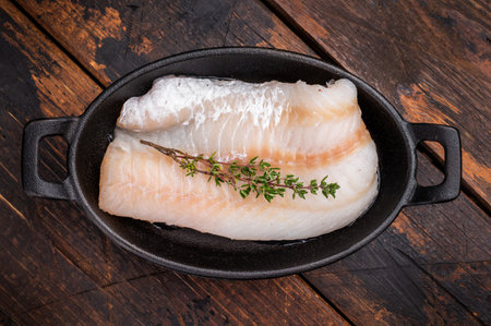 Pristine raw cod fillet, waiting to be marinated and cooked to perfection for a delightful dining...