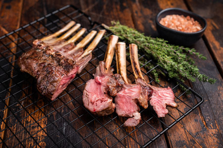 Grilled Rack of lamb, mutton meat chop steaks with thyme. wooden background. top view.の写真素材