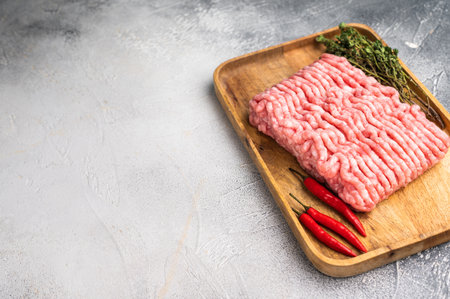 Uncooked mince veal and pork meat, raw forcemeat. white background. top view.