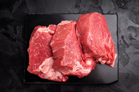 Raw beef boneless shank shin presented with herbs and spices, inspiring bold flavors and unique...