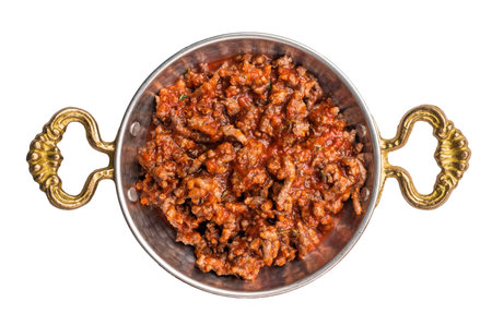 Fried minced beef with tomato paste, in a skillet isolated on white background.の写真素材