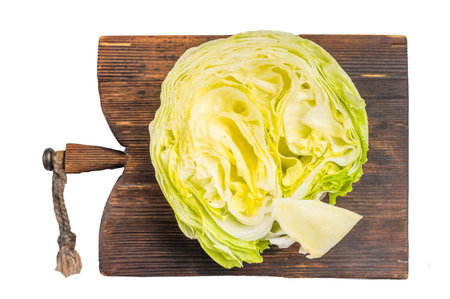 Sliced iceberg lettuce cabbage isolated on white background. top view.