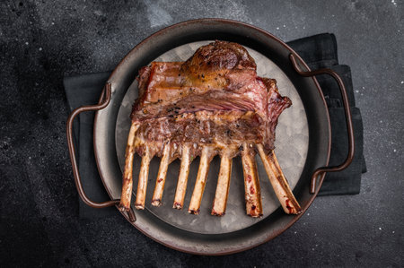 Roast Rack of lamb chops, mutton organic meat. black background. top view.の写真素材