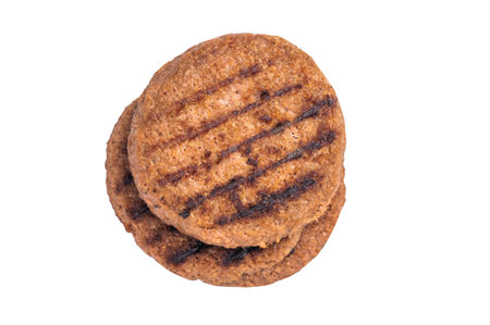 Grilled plant based burger patty vegan meat alternative with grill marks isolated on white...