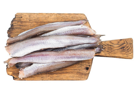 Minimal seafood styling with raw blue whiting fish on isolated background, fresh marine ingredient...