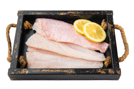 Raw redfish fillet isolated on white background. Fresh marine seafood ingredient for cooking