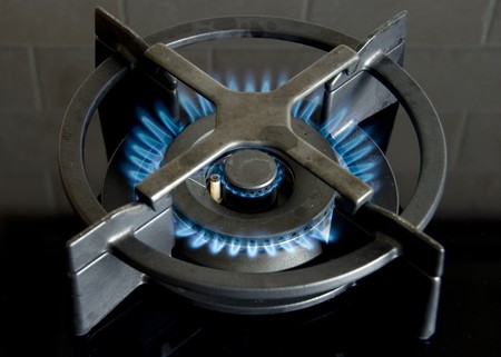 heating gas in kitchen for food preparingの写真素材
