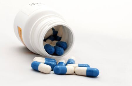 blue white capsules as a medicineの写真素材