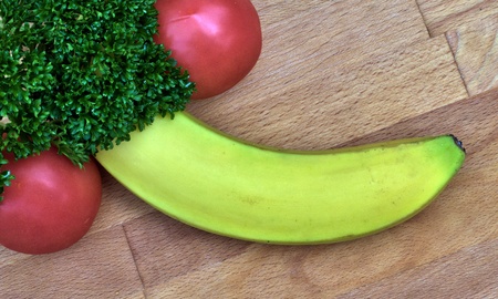 erotic food banana tomato and parsleyの写真素材