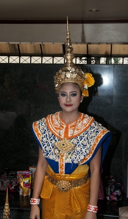 BANGKOK - APRIL 4: Unidentified girl in tradition costume ready for a riligious dance on April 04, 2011 in bangkok, Thailand, the girls dance and prey for you for moneyのeditorial素材
