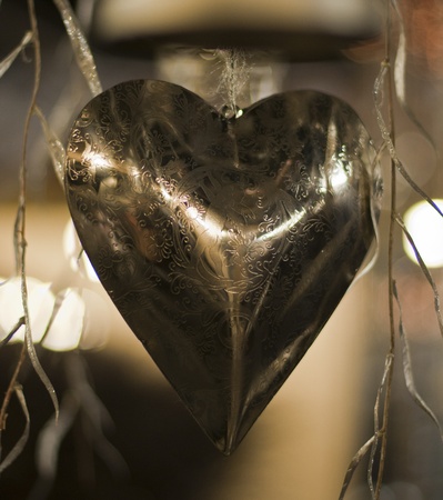 decoration from a metal hart with reflectionの写真素材