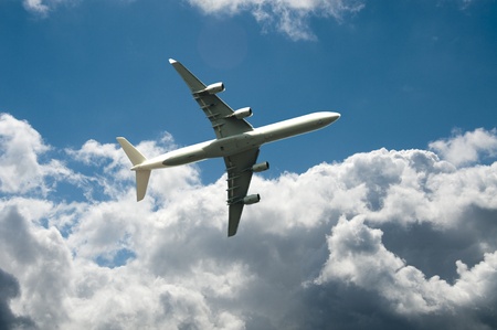 fly away with the plane in blue skyの写真素材