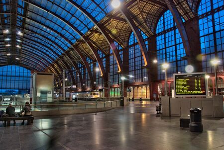 people waiting in blue stationhall antwerp stationのeditorial素材
