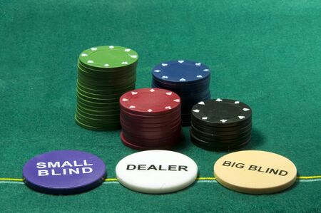 poker chips and the dealer small blind and the bigblindの写真素材