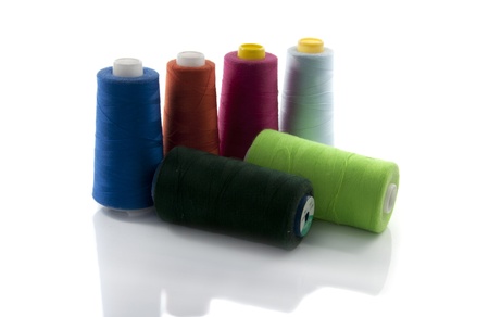 spools with cotton for manufacturing and sewingの写真素材
