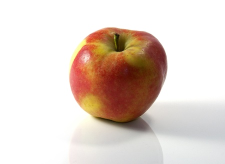 fresh golden delicious red and yellow appleの写真素材