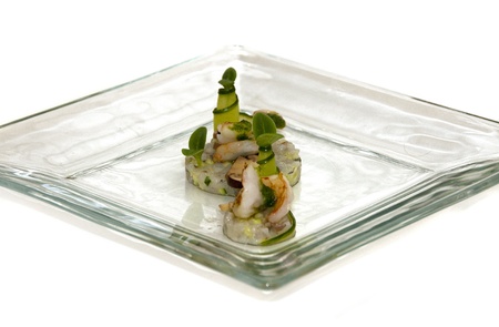 plate with fish cuisine isolated on whiteの写真素材