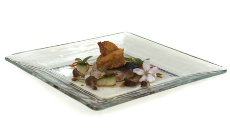 plate with fish cuisine isolated on whiteの写真素材