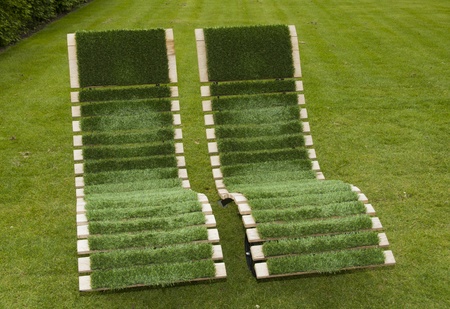 green chairs made from wood and grassの写真素材