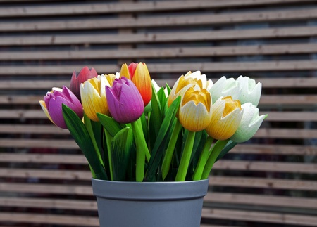 wooden tulips as decoration in yellow red pink and whiteの写真素材