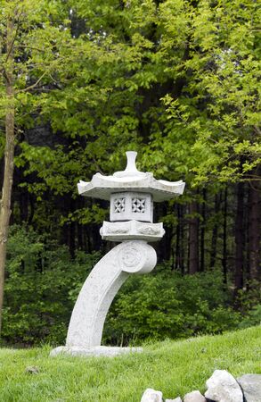 Green grass and japanese garden ornamentの写真素材