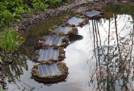 modern solar cells in garden used for the energy delivering for the water pumpの写真素材