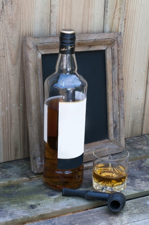 still life with whisky and a pipeの写真素材