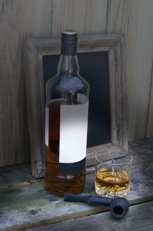 still life with whisky and a pipeの写真素材