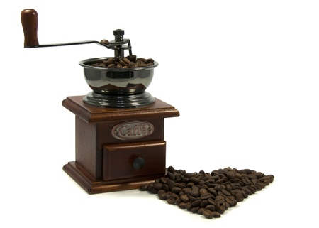 coffee grinder with beans in heart shapeの写真素材