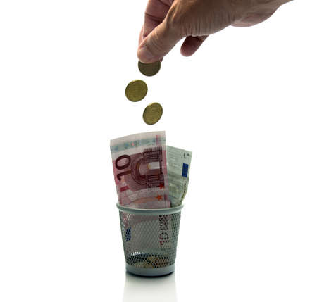 hand throws euro money in containerの写真素材