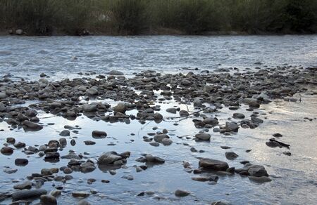 water flow over the rocks in the riverの写真素材