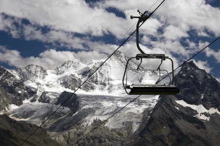 chairlift in Switserland with the mountains and snow as backgroundの写真素材