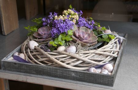 pink purple flower arangement with sedum and green leavesの写真素材