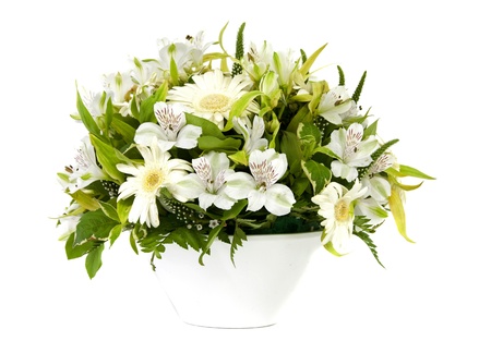 white vase and flowers on light backgroundの写真素材