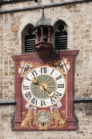 old clock on church in Memmingen germanyの写真素材