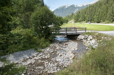landscape italy trentino area with water rocks and bridgeの写真素材