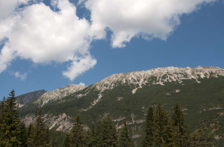 blue sky and green mountains in north austriaの写真素材